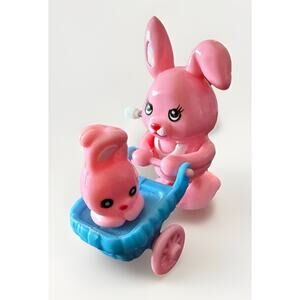 Pink Plastic Wind up Momma Rabbit pushing her baby Bunny in a Carriage Works